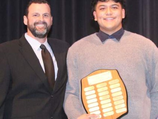 Coach Matt Clayton handed out the Outstanding Offensive Lineman Award to Kieran Garris.