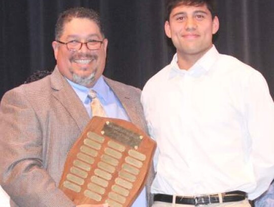 Coach David Cruhm handed out the Outstanding Defensive Lineman Award to Robin Vargas.