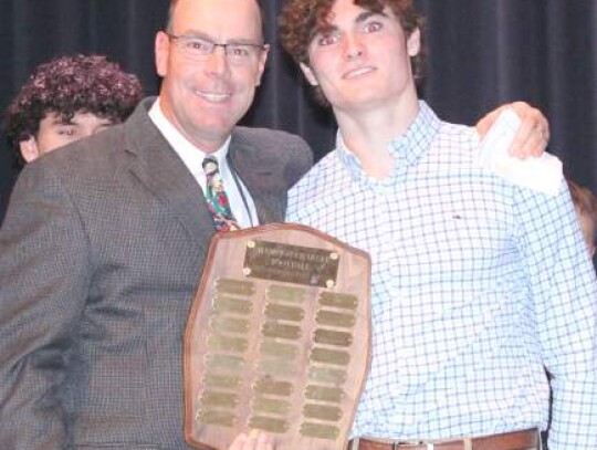 Coach John Uecker handed out the Outstanding Defensive Back Award to Evan Kuhl. 