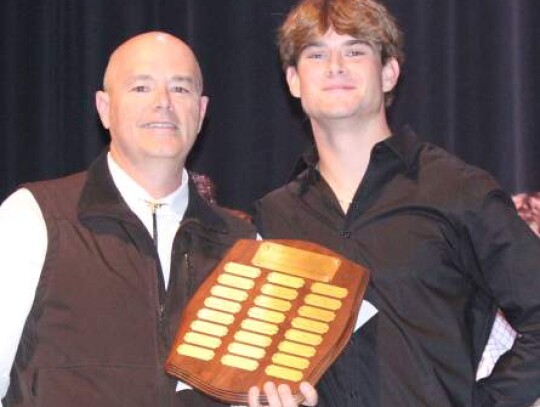 Coach Craig Westmoreland handed out the Outstanding Linebacker Award to Hayden Niemeyer.