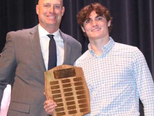 Coach Blane Ellis handed out the Champion Defensive Club Award to Evan Kuhl after Kuhl finished with more than 100 tackles.