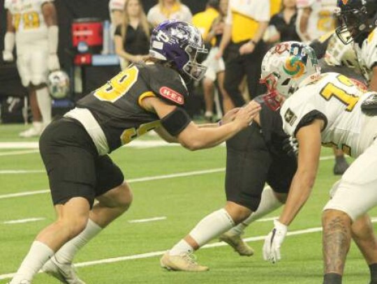 Boerne’s Jeffrey Brown rushes in for Team Black from the defensive line position during last week’s game.