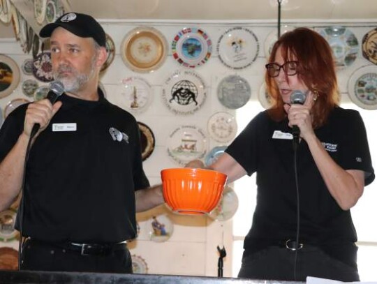 Baron and Shan Wiley, cofounders of Boerne Radio, gear up to announce who won $1,000 in advertising on the radio station – a prize only afforded to someone who brought an Easter basket for donation.