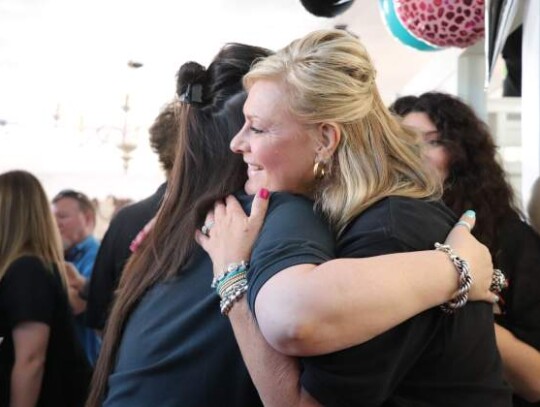 The Pearl Antler staff took turns hugging businessowner Reagan Harris in honor of the store’s new Main Street location – a dream shared and made a reality by both staffers and Harris alike.