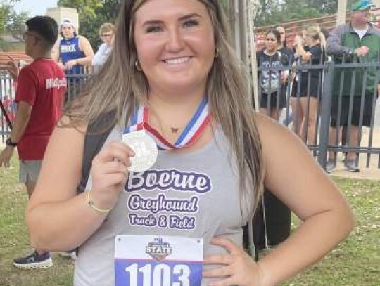 Boerne High's Tori Adams with the silver medal she won in the shot put during Thursday's track and field meet in Austin. </br> Star photo by Kerry Barboza 