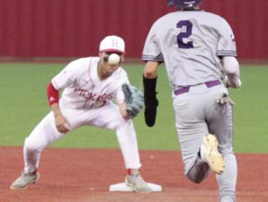 Boerne’s Jace Preston (2) heads to second base as the Robstown shortstop keeps his eyes on the ball. </br> Star photo by Kerry Barboza