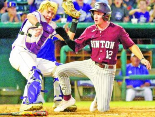 Boerne catcher Cale Black tags out a Sinton base runner at home plate during Game 1 action. </br> Star photo by Kerry Barboza