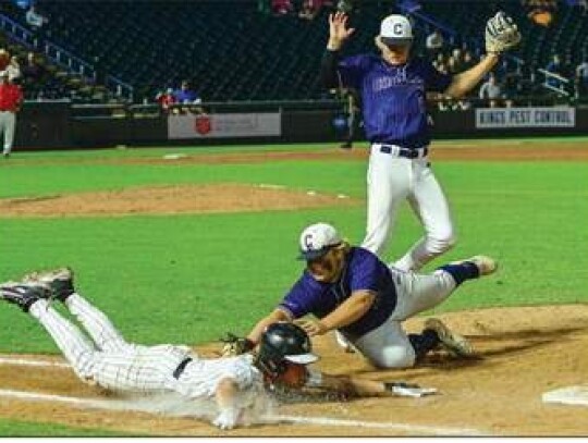 Champion first baseman Nic Cortez tags out an Argyle base runner near the bag as Charger pitcher Rowdy Miller watches the action. </br> Star photo by Chris Tilton