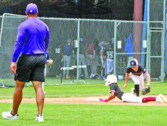 New Boerne High baseball coach Geoff Curtin watches a play at third base during one of the drills at the camp. </br> Star photo by Kerry Barboza