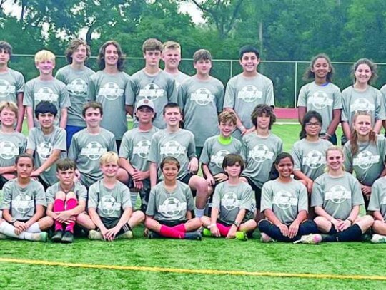 On the last day of camp, the youngsters received T-shirts and pose for a picture. </br> Star photos by Kerry Barboza