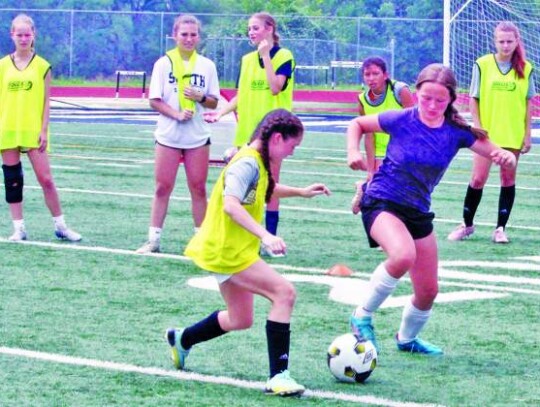 Young ladies battle one on one during competition at the camp.