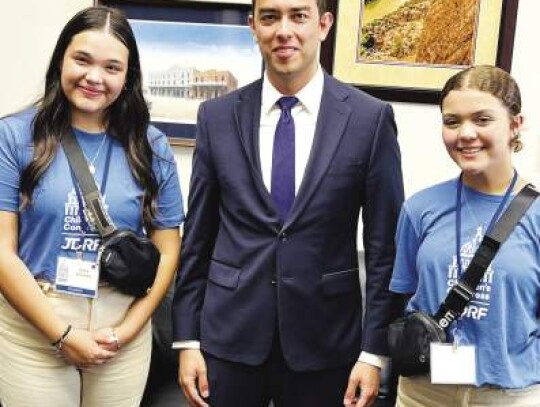 Sofia Schnoke of Boerne, left, and fellow JDRF Children’s Congress member Addie Day of San Antonio meet with David Maestas, with U.S. Rep. Tony Gonzales’ office in Washington, D.C.