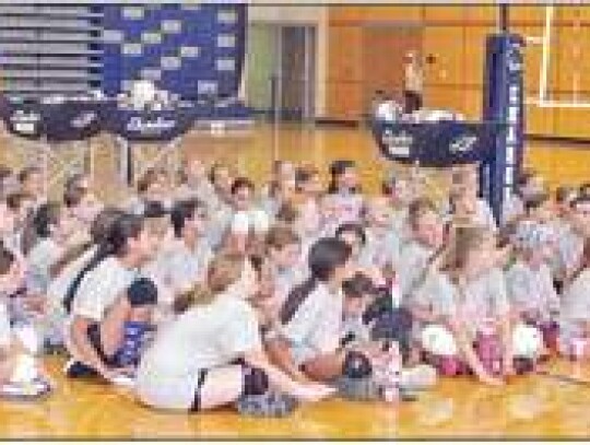 BHS head coach Tisha Pettibon talks with some of the campers at the end of drills.