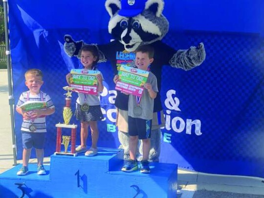 Winners in the Talladega (3-4-year olds) race division are Kohen Harle (left), third place; Josiah Elliot (right), second place, and Audrina D’Angelo, first place.