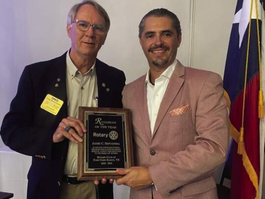 Jaime Sepulveda Jr., right, receives the 2022-23 Rotary Club of Fair Oaks Ranch “Rotarian of the Year” award from outgoing Rotary President Greg Buschmann.