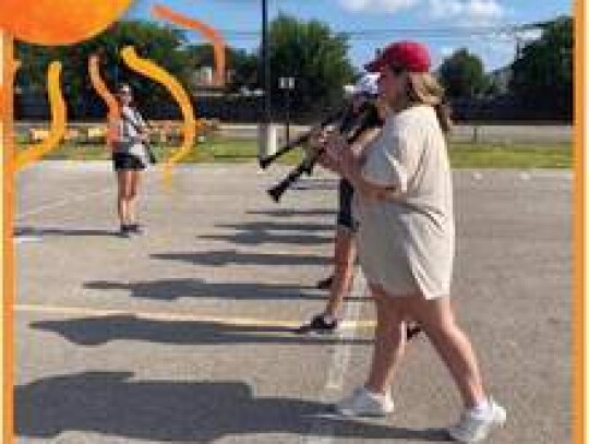 Above: Members of the Champion High School marching band practice forward marching during their 8 a.m. July 25 rehearsal. Primitivo Tristan, the assistant band director at Voss Middle School and a marching technician for Champion, examined the students' f