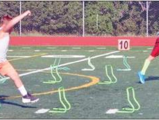 Some of the younger campers work on an agility drill at Charger Field.