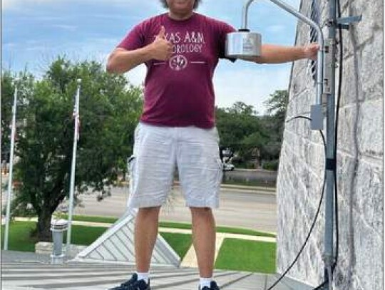 Tim Logan, an assistant professor in the Department of Atmospheric Sciences at Texas A&amp;M, donated the Boltek lightning detection system to Boerne and was on hand June 22 for its installation at the Boerne Fire Station. Courtesy Photo.