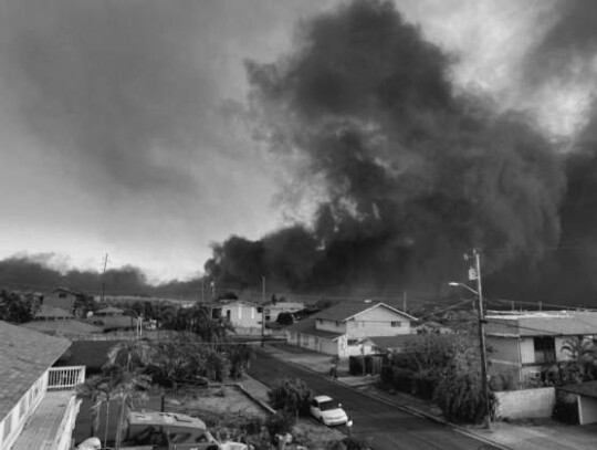 A monstrous plume of black smoke rises over Lahaina Aug. 8, as seen from the roof of Tait Maxfeldt’s residence.