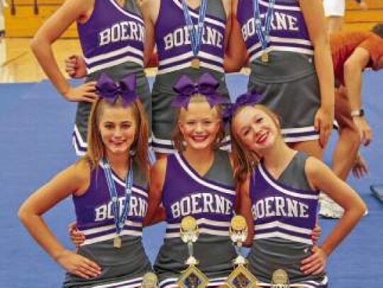 JV cheerleaders kneeling are front row (l-r): Lainie Moore, Lila Sherrill and Lyla Lever. Back row (l-r): Cadence Ostrander, Madison Weber and Macey Edge. Not pictured: Lila Morrison.