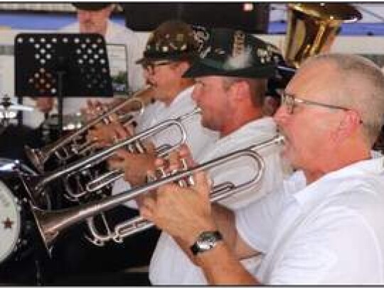 Boerne Village Band members (from right) Kent Grist, Sean Schmidt and Larry Schmidt play their portion of traditional German marches and polkas during Sunday’s musical entertainment at the fair.