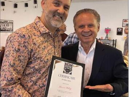 Newly inducted San Antonio Radio Hall of Fame member Baron Wiley (left) is congratulated at the Aug. 13 induction by Hall of Famer and mentor Sonny Melendrez.